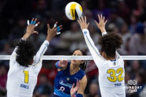 Omaha Supernovas Reagan Cooper (8) spikes the ball against San Diego Mojo Rainelle Jones (1) and Lauren Page (32) during a professional volleyball match, Sunday, January 19, 2025, in Omaha, Nebraska. Photo by John S. Peterson.