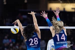 Omaha Supernovas Kayla Caffey (28) with Ally Batenhorst (14) blocks a spike from San Diego Mojo Maya Tabron (31) during a professional volleyball match, Sunday, January 19, 2025, in Omaha, Nebraska. Photo by John S. Peterson.