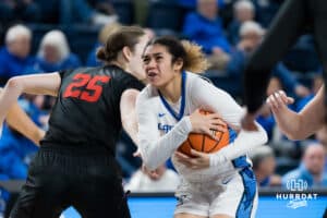 Creighton Bluejay Kiani Lockett driving in for a layup during a basketball game at Sokol Arena on Saturday, January 18, 2025, in Omaha, Nebraska. Photo by Collin Stilen.