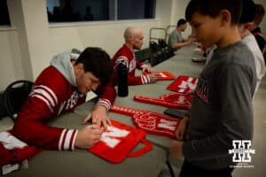 Nebraska's Harley Andrews talking with fans and signing autographs after the match against Penn State, Friday, January 17, 2025, in Lincoln, Nebraska. Photo by John S. Peterson.