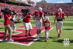 Taylor Martinez #3 walks Jack Hollman (22) off the field after Jack scores a touchdown for the Red team during Red-White spring game Saturday, April 6, 2013 in Memorial Stadium. Photo by John S. Peterson.