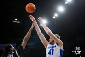Creighton Bluejays forward Isaac Traudt (41) makes three-point shot against Providence Friars guard Corey Floyd Jr. (14) in the second half during a college basketball game, Tuesday, January 14, 2025, in Omaha, Nebraska. Photo by John S. Peterson.