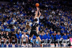 Creighton Bluejays forward Isaac Traudt (41) makes a three-point shot over Providence Friars forward Ryan Mela (11) in the second half during a college basketball game, Tuesday, January 14, 2025, in Omaha, Nebraska. Photo by John S. Peterson.