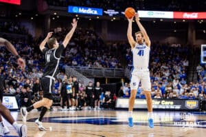 Creighton Bluejays forward Isaac Traudt (41) makes a three-point shot against Providence Friars forward Ryan Mela (11) in the second half during a college basketball game, Tuesday, January 14, 2025, in Omaha, Nebraska. Photo by John S. Peterson.