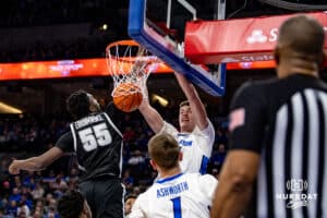 Creighton Bluejays center Ryan Kalkbrenner (11) dunks the ball against Providence Friars forward Oswin Erhunmwunse (55) in the first half during a college basketball game, Tuesday, January 14, 2025, in Omaha, Nebraska. Photo by John S. Peterson.
