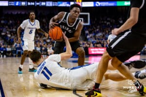 Creighton Bluejays center Ryan Kalkbrenner (11) dives to take the ball away from Providence Friars guard Jayden Pierre (1) in the first half during a college basketball game, Tuesday, January 14, 2025, in Omaha, Nebraska. Photo by John S. Peterson.