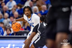 Creighton Bluejays guard Jamiya Neal (5) dribbles the ball against Providence Friars guard Corey Floyd Jr. (14) in the firt half during a college basketball game, Tuesday, January 14, 2025, in Omaha, Nebraska. Photo by John S. Peterson.