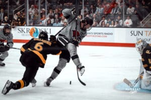 UNO Mavericks player, Liam Watkins, fights for the puck during a college hockey game on Jan 11th, 2025 in Omaha, Nebraska. Photo by Logan Hock