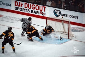 UNO Mavericks player, Jimmy Glynn, takes a shot at the goal during a college hockey game on Jan 11th, 2025 in Omaha, Nebraska. Photo by Logan Hock