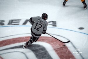 UNO Mavericks player, Nolan Krenzen, handles the puck during a college hockey game on Jan 11th, 2025 in Omaha, Nebraska. Photo by Logan Hock