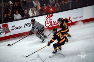 UNO Mavericks player, Sam Stange, captures the puck during a college hockey game on Jan 11th, 2025 in Omaha, Nebraska. Photo by Logan Hock