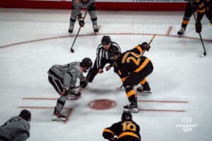 UNO Mavericks player, Liam Watkins, faces off with opponent during a college hockey game on Jan 11th, 2025 in Omaha, Nebraska. Photo by Logan Hock