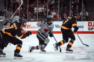 UNO Mavericks player, Tyler Rollwagen, looks for the puck during a college hockey game on Jan 11th, 2025 in Omaha, Nebraska. Photo by Logan Hock