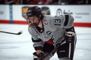 UNO Mavericks player, Jacob Slipec, gets ready to move during a college hockey game on Jan 11th, 2025 in Omaha, Nebraska. Photo by Logan Hock