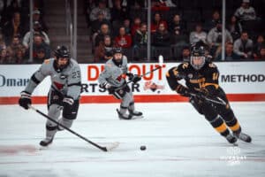 UNO Mavericks player, Harrison Israels, rushes for a puck during a college hockey game on Jan 11th, 2025 in Omaha, Nebraska. Photo by Logan Hock
