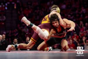 #5 Nebraska Cornhusker Ridge Lovett shoots for the leg against #21 Minnesota Golden Gopher Drew Roberts during a college wrestling match, Saturday, January 11, 2025, in Lincoln, Nebraska. Lovett defeats Roberts 5-0. Photo by John S. Peterson.