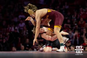 #19 Nebraska Cornhusker Jacob Van Dee shoots for the leg against #11 Minnesota Golden Gophers Tyler Wells during a college wrestling match, Saturday, January 11, 2025, in Lincoln, Nebraska. Van Dee upsets Wells 4-1. Photo by John S. Peterson.