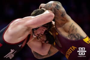 #24 Nebraska Cornhuskers Harley Andrews takes on #1 Minnesota Golden Gopher Gable Stevens during a college wrestling match, Saturday, January 11, 2025, in Lincoln, Nebraska. Steveson defeats Andrews 19-4. Photo by John S. Peterson.