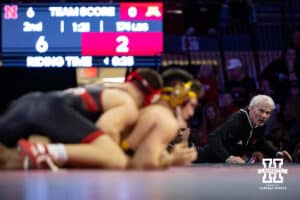 Nebraska Cornhusker head coach Mark Manning keep a close eye on #16 Nebraska Cornhusker Lenny Pinto and #24 Minnesota Golden Gopher Clayton Whiting during a college wrestling match, Saturday, January 11, 2025, in Lincoln, Nebraska. Pinto defeats Whiting 9-3. Photo by John S. Peterson.