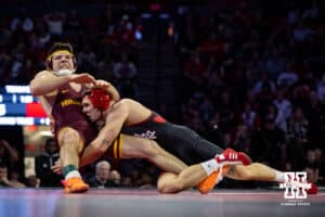 #16 Nebraska Cornhusker Lenny Pinto takes down #24 Minnesota Golden Gopher Clayton Whiting during a college wrestling match, Saturday, January 11, 2025, in Lincoln, Nebraska. Pinto defeats Whiting 9-3. Photo by John S. Peterson.