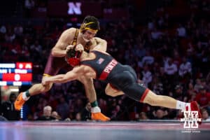 #16 Nebraska Cornhusker Lenny Pinto shoots for a leg against #24 Minnesota Golden Gopher Clayton Whiting during a college wrestling match, Saturday, January 11, 2025, in Lincoln, Nebraska. Pinto defeats Whiting 9-3. Photo by John S. Peterson.