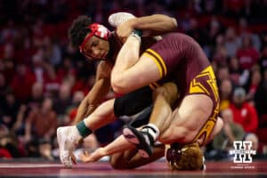Nebraska Cornhusker Christopher Minto wrestles against #9 Minnesota Golden Gopher Andrew Sparks during a college wrestling match, Saturday, January 11, 2025, in Lincoln, Nebraska. Minto upsets Sparks 5-4. Photo by John S. Peterson.