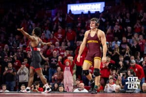 #5 Nebraska Cornhusker Anttrell Taylor celebrates the overtime win over #10 Minnesota Golden Gopher Tommy Askey during a college wrestling match, Saturday, January 11, 2025, in Lincoln, Nebraska. Taylor defeats Askey 4-1. Photo by John S. Peterson.