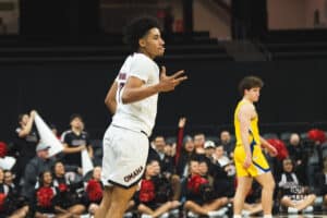 Omaha Maverick Lance Waddles celebrates a three pointer during a basketball game at Baxter Arena on January 11th, 2025 in Omaha Nebraska. Photo by Collin Stilen.