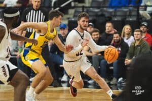 Omaha Maverick Tony Osburn goes for a drive during a basketball game at Baxter Arena on January 11th, 2025 in Omaha Nebraska. Photo by Collin Stilen.