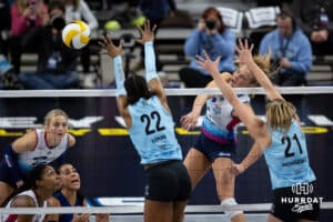 Omaha Supernovas outside hitter Brooke Nuneviller (5) spikes the ball against Atlanta Vibe middle blocker Khori Louis (22) and setter Marlie Monserez (21) during a professional volleyball match, Friday, January 10, 2025, in Omaha, Nebraska. Photo by John S. Peterson.John S. Peterson.