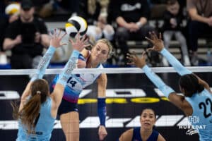 Supernovas outside hitter Ally Batenhorst (14) spikes the ball against Atlanta Vibe outside hitter Pia Timmer (7) and middle blocker Khori Louis (22) during a professional volleyball match, Friday, January 10, 2025, in Omaha, Nebraska. Photo by John S. Peterson.