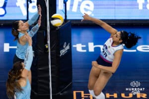 Omaha Supernovas middle blocker Kayla Caffey (28) spikes the ball against Atlanta Vibe opposite hitter Merritt Beason (5) in the second set during a professional volleyball match, Friday, January 10, 2025, in Omaha, Nebraska. Photo by John S. Peterson.