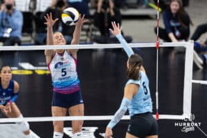 Omaha Supernovas outside hitter Brooke Nuneviller (5) jumps to block a spike from Atlanta Vibe opposite hitter Merritt Beason (5) in the second set during a professional volleyball match, Friday, January 10, 2025, in Omaha, Nebraska. Photo by John S. Peterson.