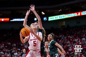 Nebraska Cornhuskers guard Alberte Rimdal (5) makes a layup against Michigan State Spartans guard Emma Shumate (5) in the second half during a college basketball game, Wednesday, January 8, 2025, in Lincoln, Nebraska. Photo by John S. Peterson.