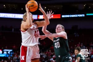 Nebraska Cornhuskers center Alexis Markowski (40) makes a layup against Michigan State Spartans guard Julia Ayrault (40) in the third quarter during a college basketball game, Wednesday, January 8, 2025, in Lincoln, Nebraska. Photo by John S. Peterson.