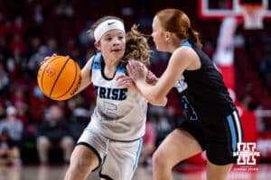 Arise team member dribbles the ball at a halftime game during a college basketball game between the Nebraska Cornhuskers and the Michigan State Spartans, Wednesday, January 8, 2025, in Lincoln, Nebraska. Photo by John S. Peterson.