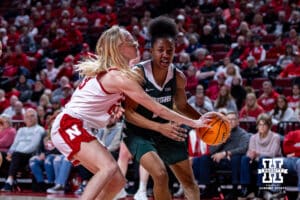 Nebraska Cornhuskers guard Britt Prince (23) knocks the ball away from Michigan State Spartans guard Jaddan Simmons (1) in the second quarter during a college basketball game, Wednesday, January 8, 2025, in Lincoln, Nebraska. Photo by John S. Peterson.