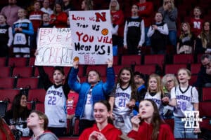 Nebraska Cornhuskers fans holding signs against the Michigan State Spartans during a college basketball game, Wednesday, January 8, 2025, in Lincoln, Nebraska. Photo by John S. Peterson.