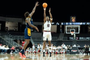 Omaha Mavericks Marquel Sutton attempts a contested three pointer during a college basketball game against Kansas City on January 8th, 2025 in Omaha Nebraska. Photo by Brandon Tiedemann.