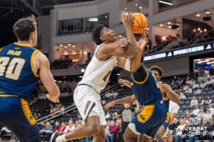 Omaha Mavericks Marquel Sutton getting fouled while attempting a layup during a college basketball game against Kansas City on January 8th, 2025 in Omaha Nebraska. Photo by Brandon Tiedemann.
