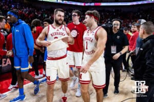 Nebraska Cornhuskers guard Rollie Worster (24) and guard Sam Hoiberg (1) celebrates the win over the UCLA Bruins as the head to the locker room during college basketball game, Saturday, January 4, 2024, in Lincoln, Nebraska. Photo by John S. Peterson.