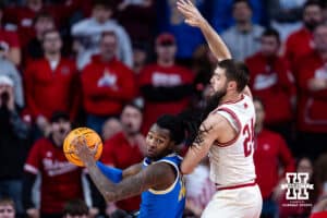 Nebraska Cornhuskers guard Rollie Worster (24) defends against UCLA Bruins guard Sebastian Mack (12) in the second half during college basketball game, Saturday, January 4, 2024, in Lincoln, Nebraska. Photo by John S. Peterson.