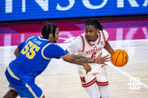 Nebraska Cornhuskers guard Ahron Ulis (2) dribbles the ball aginst UCLA Bruins guard Skyy Clark (55) in the second half during college basketball game, Saturday, January 4, 2024, in Lincoln, Nebraska. Photo by John S. Peterson.
