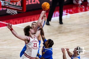 Nebraska Cornhuskers forward Andrew Morgan (23) reaches for the ball against the UCLA Bruins in the second half during college basketball game, Saturday, January 4, 2024, in Lincoln, Nebraska. Photo by John S. Peterson.