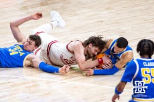 Nebraska Cornhuskers forward Andrew Morgan (23) fights for the loose ball against UCLA Bruins guard Kobe Johnson (0) in the second half during college basketball game, Saturday, January 4, 2024, in Lincoln, Nebraska. Photo by John S. Peterson.