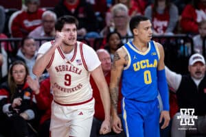 Nebraska Cornhuskers forward Berke Buyuktuncel (9) gives a fist pump against UCLA Bruins guard Kobe Johnson (0) in the first half during college basketball game, Saturday, January 4, 2024, in Lincoln, Nebraska. Photo by John S. Peterson.
