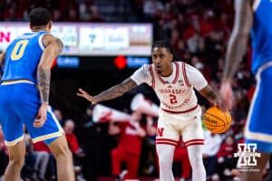 Nebraska Cornhuskers guard Ahron Ulis (2) dribbles the ball against UCLA Bruins guard Kobe Johnson (0) in the first half during college basketball game, Saturday, January 4, 2024, in Lincoln, Nebraska. Photo by John S. Peterson.