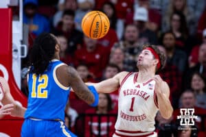 Nebraska Cornhuskers guard Sam Hoiberg (1) steals the ball away from UCLA Bruins guard Sebastian Mack (12) in the first half during college basketball game, Saturday, January 4, 2024, in Lincoln, Nebraska. Photo by John S. Peterson.