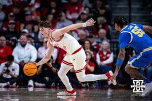 Nebraska Cornhuskers guard Connor Essegian (0) dribbles the ball against UCLA Bruins guard Skyy Clark (55) turnover the ball in the first half during college basketball game, Saturday, January 4, 2024, in Lincoln, Nebraska. Photo by John S. Peterson.