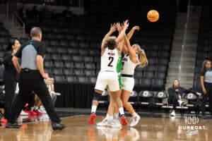 Omaha Mavericks Lauren Perry and Cora Olsen trapping a defender during a college basketball game against North Dakota on January 2nd, 2025 in Omaha Nebraska. Photo by Brandon Tiedemann.